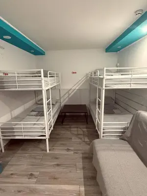 a room with three bunk beds and a couch at SOVA smart HOUSE in Bar