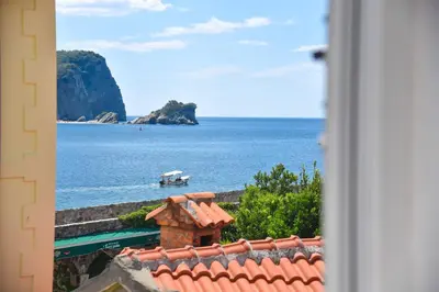 a view of the ocean from a window at Apartman Senka in Budva