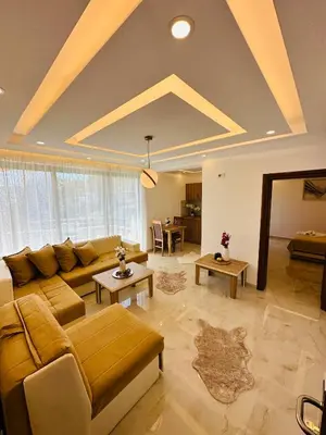 a large living room with a couch and tables at Luxury Villa Ulcinj in Ulcinj