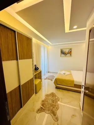 a bedroom with a bed and a rug on the floor at Luxury Villa Ulcinj in Ulcinj