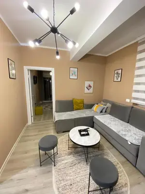 a living room with a couch and a table at Apartment SONJA in Ulcinj