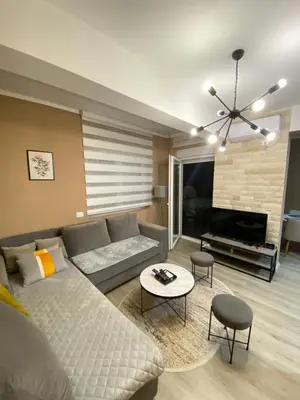 a living room with a couch and a table at Apartment SONJA in Ulcinj
