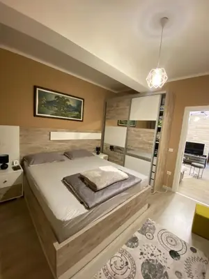 a bedroom with a large bed in a room at Apartment SONJA in Ulcinj