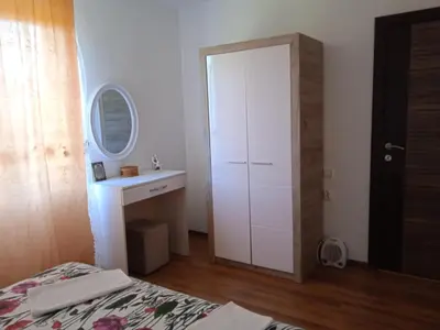 a bedroom with a white cabinet and a sink at Villa Elena Zagora in Neodi