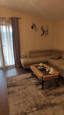 a living room with a couch and a coffee table at MASA in Bar