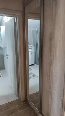 a mirror in a room with a refrigerator at MASA in Bar