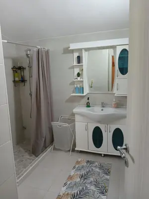 a bathroom with a sink and a mirror and a shower at MASA in Bar