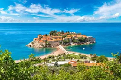 an island in the middle of a body of water at BARBARA SVETI STEFAN in Sveti Stefan