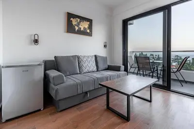 a living room with a couch and a table at CASA BIANCA & Spa 2 in Ulcinj