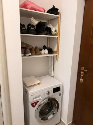 a washer and dryer in a small room at apartman Natali in Budva