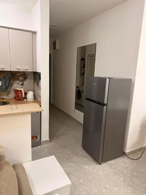 a kitchen with a stainless steel refrigerator in a room at apartman Natali in Budva