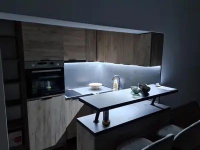 a small kitchen with a sink and a counter at Darin in Budva