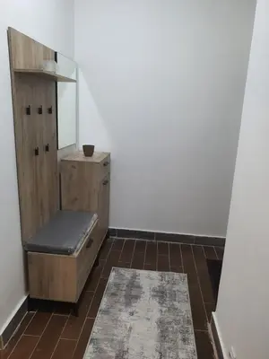 a dressing room with a bench and a mirror at Darin in Budva