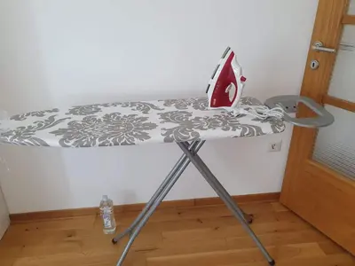 a table with a iron on top of it at Lijepo pozicioniran stan, atrakcije blizu in Podgorica