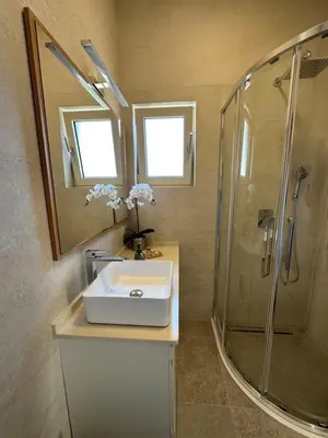 a bathroom with a sink and a shower at Point of View in Kotor