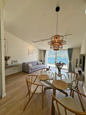 a living room with a table and chairs and a couch at Point of View in Kotor