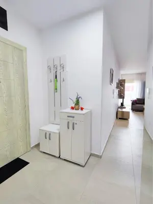 a room with white walls and a white floor at Ambassador Apartment Bečići with Private Garage Parking in Becici