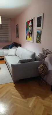 a living room with a couch and a table at Dream Studio in Budva