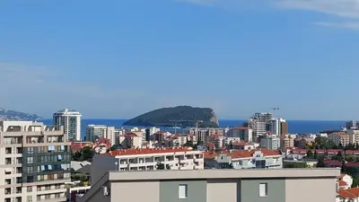 a view of a city with buildings and the ocean at Dream Studio in Budva