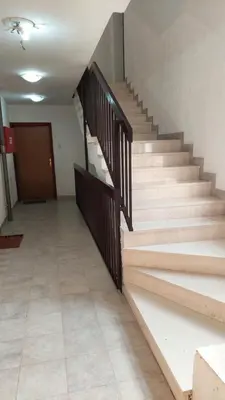 an empty hallway with stairs in a building at Dream Studio in Budva
