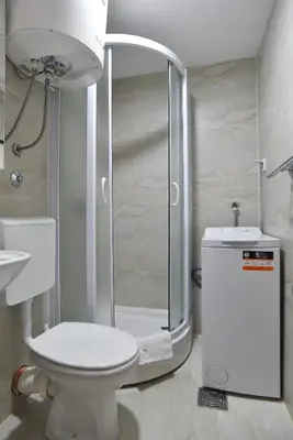 a bathroom with a shower and a toilet and a sink at Apartmani Bojana in Budva
