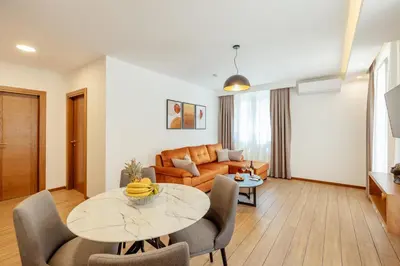 a living room with a table and a couch at Villa Elle in Kotor