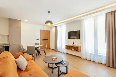 a living room with a couch and a table at Villa Elle in Kotor