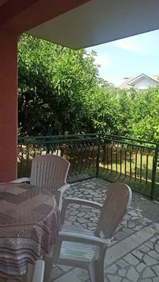 two chairs and a table on a patio at Lemon Tree in Ulcinj