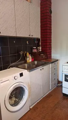 a kitchen with a washing machine and a sink at Lemon Tree in Ulcinj
