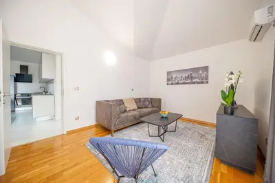 a living room with a couch and a table at Sotto Sole apartment in Bar
