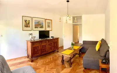 a living room with a couch and a tv at Old town in Podgorica
