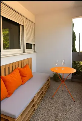 a bedroom with a bed and a table at Old town in Podgorica