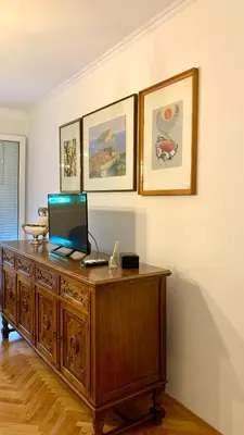 a desk with a laptop computer on top of it at Old town in Podgorica