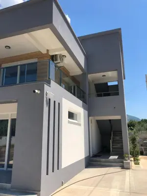 a modern house with a gray and white at Villa MERKURY in Sutomore