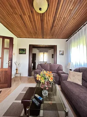 a living room with a couch and a table at Kaldrmica in Gornji Brčeli