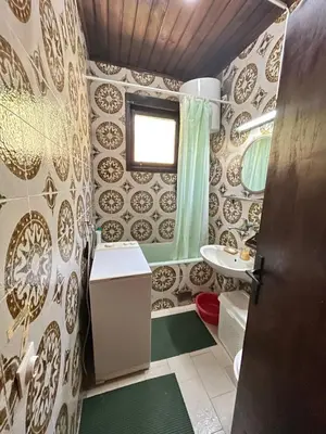 a bathroom with a shower and a sink and a toilet at Kaldrmica in Gornji Brčeli