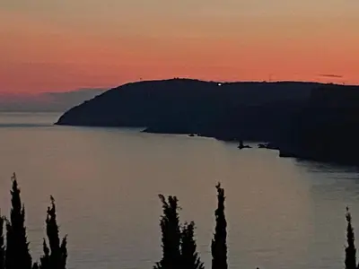 a view of a body of water at sunset at Guest house Ruzica in Sutomore