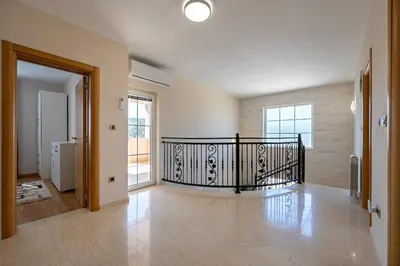 an empty hallway with a staircase in a house at Villa Stemi in Tivat