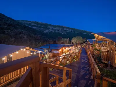 a view of a resort at night at Sea Glamping in Kotor