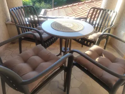 a table and chairs sitting on a patio at Luxury Home Cetinje in Cetinje