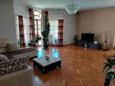 a living room with a couch and a coffee table at Luxury Home Cetinje in Cetinje