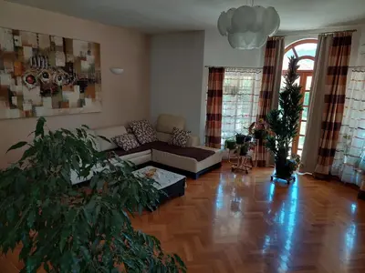 a living room with a couch and a table at Luxury Home Cetinje in Cetinje