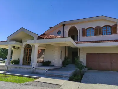 a large house with a garage at Luxury Home Cetinje in Cetinje