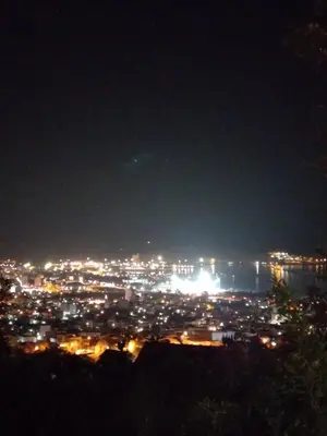 a view of a city lit up at night at Studio Apartman Susanj Bar in Bar
