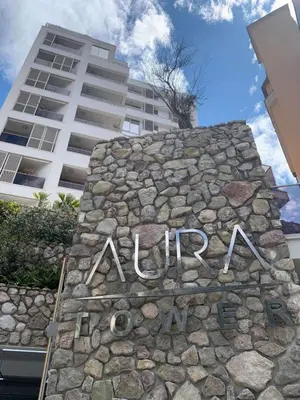 a sign on a stone wall in front of a building at AURA TOWER Apartments by Gaby in Rafailovici