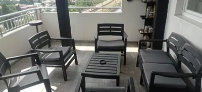 a group of chairs and a table on a balcony at VuJo in Sutomore