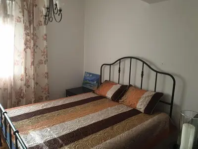 a bed with two pillows on it in a bedroom at Mari in Ulcinj