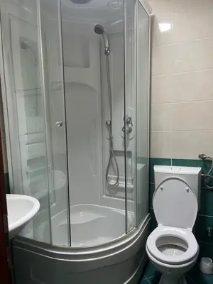 a bathroom with a shower with a toilet and a sink at Mari in Ulcinj