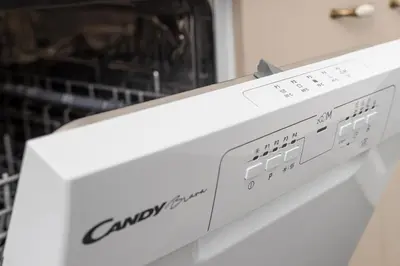 a white microwave oven sitting on top of a appliance at Studio apartman Scardona in Kotor