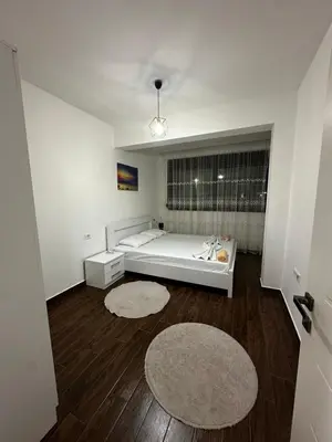 a large bathroom with a tub and a bed at Capitol Apartments in Ulcinj